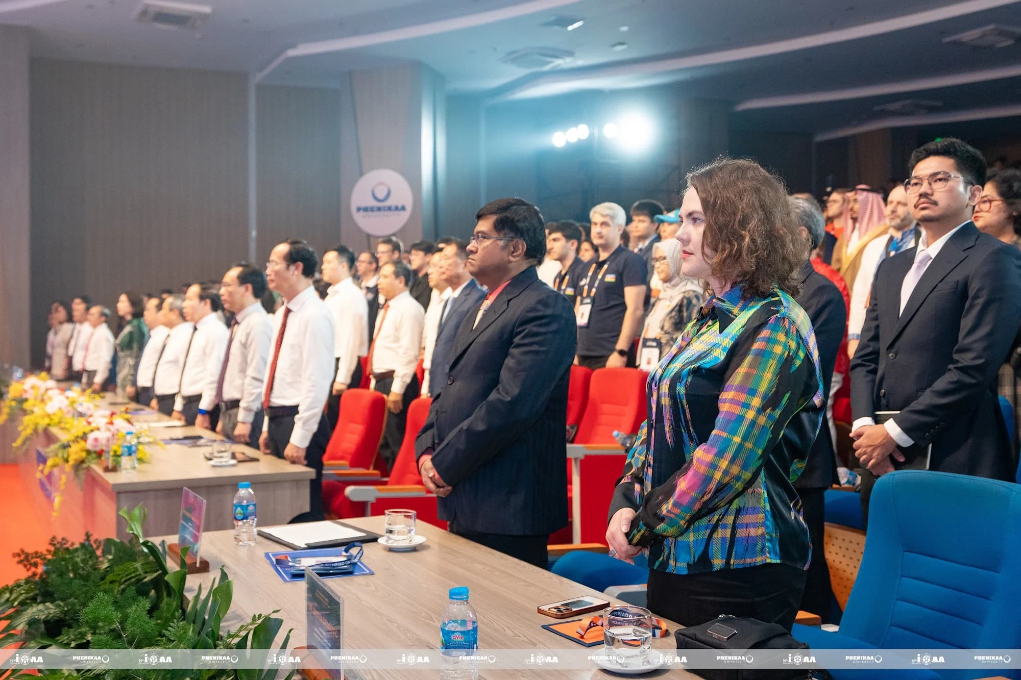 Delegates take part in the flag-salute ceremony at the IOAA 2026 Opening Ceremony.